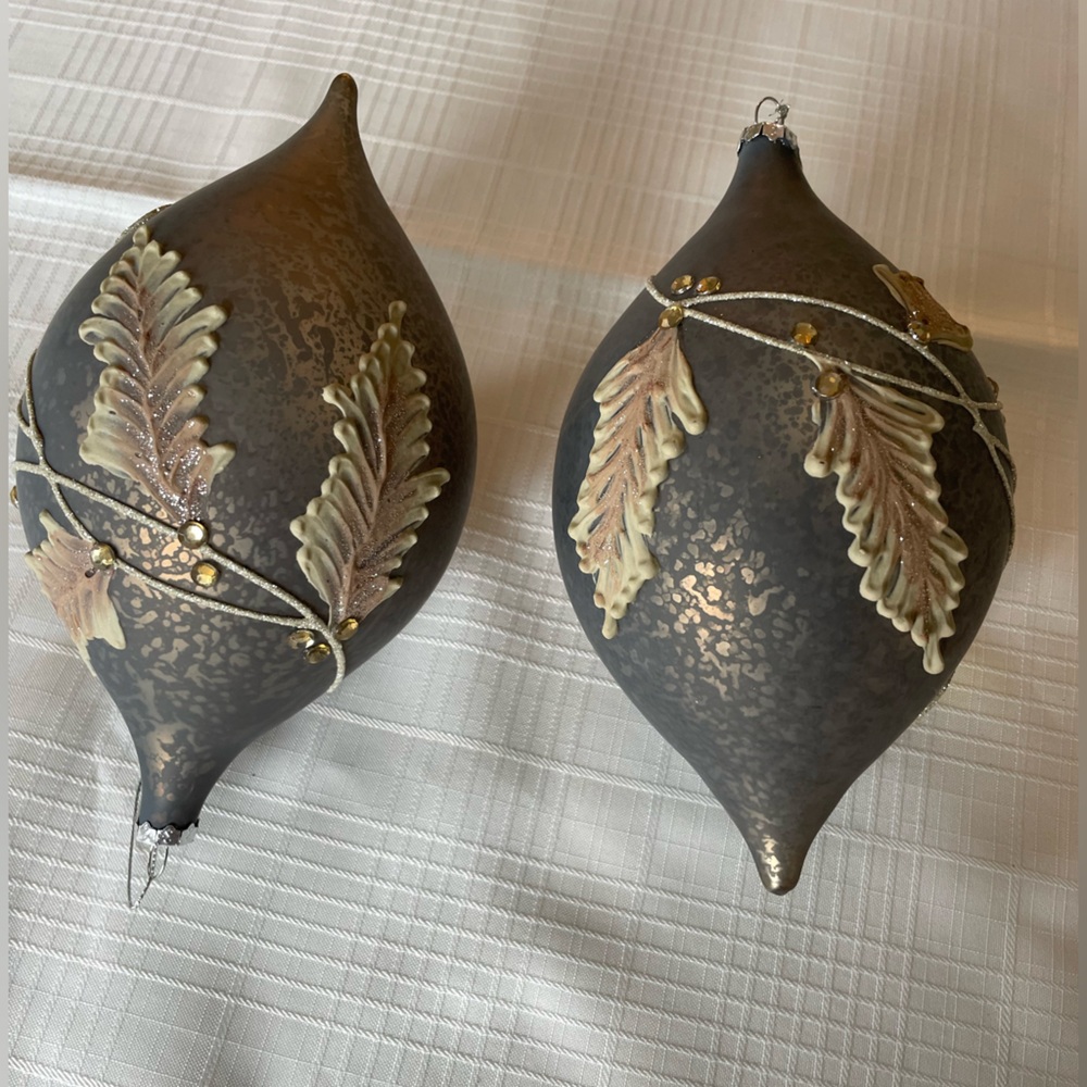Set of 2 glass holiday ornaments approximately 5" wide and 9" tall